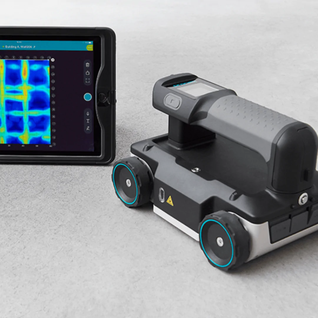 Prime Edge worker using a concrete scanning device in a construction site